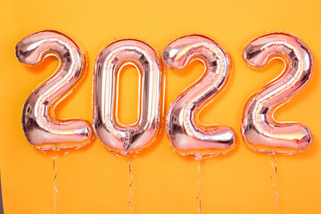Balloon number 2022 Happy New Year Object render ballon with ribbon yellow background