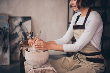 Cropped photo of pottery artwork owner lady do porcelain earthenware pot form hands use tool equipment