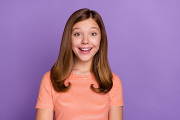 Portrait of attractive cheerful brown-haired girl laughing joke isolated over vibrant violet purple...