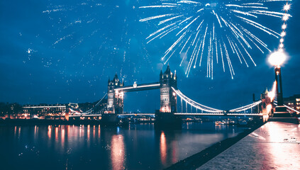 Famous Tower Bridge in the evening with fireworks, London, England