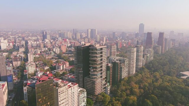 Mexico City: Aerial view of capital city of Mexico, park Bosque de Chapultepec and city centre skyline with modern high-rise buildings (skyscrapers) - landscape panorama of North America from above

