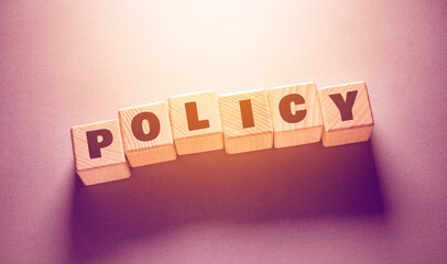 policy Word with Wooden Cubes