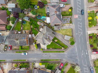 Aerial photo of the town of Batley in Yorkshire UK, showing a typical British housing estates with roads and streets, taken with a drone on a sunny day above the houses. - obrazy, fototapety, plakaty