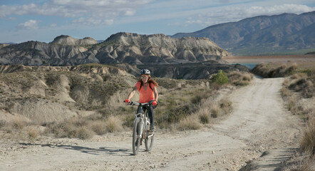 woman with mountain bike (Embalse Ageciras in Spain)