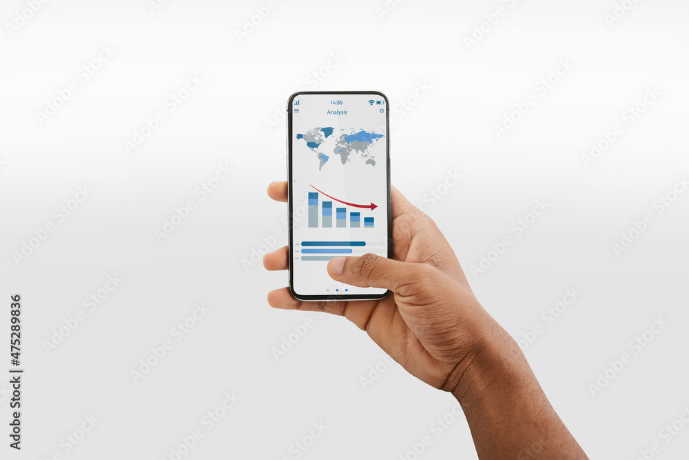 Aufkleber Unrecognizable black man using analytics mobile app on smartphone