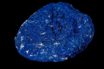 Macro mineral stone Azurite in siltstone against black background