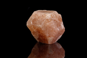 macro mineral garnet stone on a black background