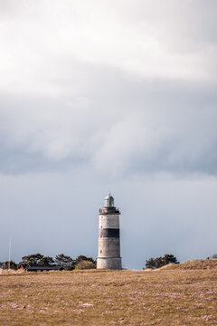 lighthouse and dramatic clouds rolling in