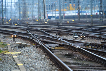 Track field with railway switches and railway signals at Zürich main railway station on a foggy winter morning. Photo taken December 15th, 2021, Zurich, Switzerland.
