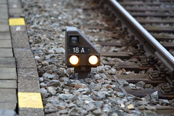 Close-up of dwarf railway signal at Zürich main railway station on a foggy winter morning. Photo...