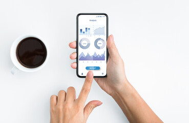 Woman using mobile app for financial operations analysis