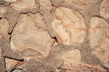 Stone wall background natural color. Closeup. Selective focus.