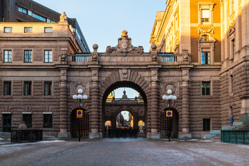 Perspective view of the Riksgatan Street and the arches of the Parliament House in sunny winter...