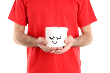 Man holds toilet paper, isolated on white background. Hemorrhoids concept