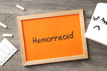 Concept of healthcare with hemorrhoids accessories on gray textured background