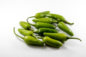 Organic fresh whole bunch of green chilli isolated on white background