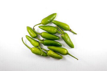 Organic fresh whole bunch of green chilli isolated on white background