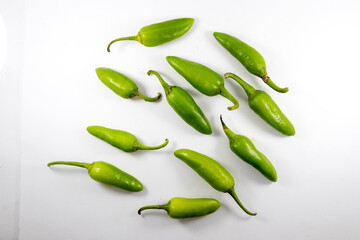 Organic fresh whole bunch of green chilli isolated on white background