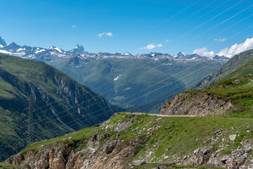 Obraz premium Alpine landscape with Nufenen Pass road near Ulrichen