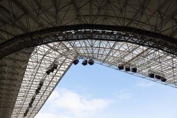 Fototapeta na wymiar lights and speakers of sport stadium, Soccer football stadium roof