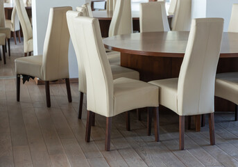 Abstract modern interior of cafe or meeting room with rounded armchairs