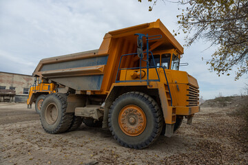Large mining dump truck. Transport industry. Extraction of stone in an open pit