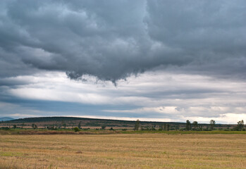 Fototapeta premium clouds over the field