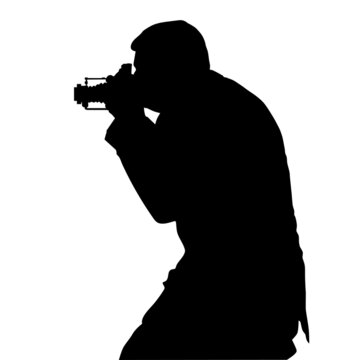 Silhouette of a man with a camera in his hands at his head. Photographer with retro photo camera sideways