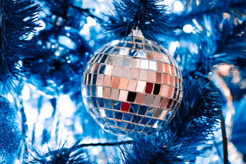 Blue and silver christmas balls on blue christmas tree