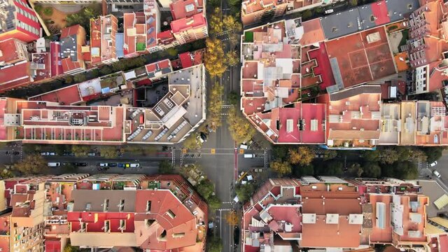 Aerial drone view of Barcelona, Spain. Blocks with multiple residential buildings, roads with cars