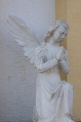 Vintage image of a sad angel on a bright background. detail