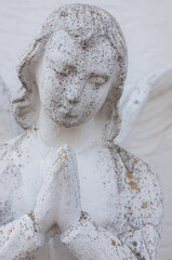 Vintage image of a sad angel on a bright background. detail