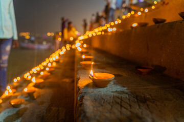 Dev Deepawali festival, Earthen lamps lit on the stairs leading to the Ganges, Varanasi Dev Diwali - obrazy, fototapety, plakaty