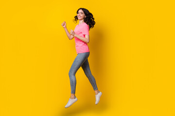 Fototapeta na wymiar Full body profile side photo of young cheerful girl jump run rush energetic isolated over yellow color background
