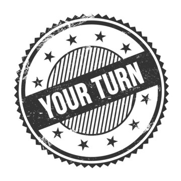 YOUR TURN text written on black grungy round stamp.
