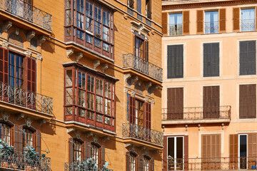 Fototapeta na wymiar Traditional buildings facades in Mallorca destination. Balearic islands. Spain