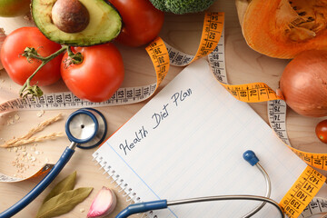 Health diet plan with notebook and healthy food detail