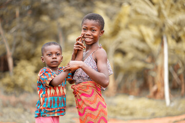 landscape image of african kids holding hands- outdoor concept