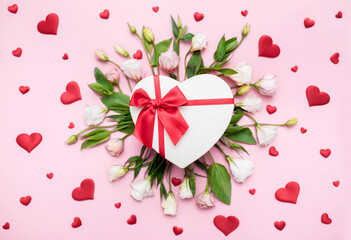 Valentine's Day. Love background. Gifts in the form of hearts on a pink background with the inscription love flower bouquet. Copy space for text. The concept of romance and love. March 8 women's Day.