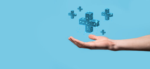 Businessman hand holding 3D plus low polygonal icon.Plus sign virtual means to offer positive thing like benefits, personal development, social network Profit,health insurance, growth concepts.