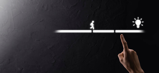 Fototapeta premium Male business man hand hold a connecting block between two sets of bridge road for a silhouetted man to walk idea icon.