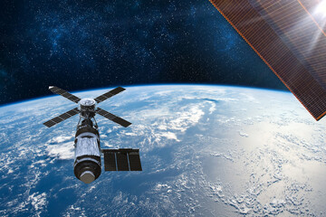 Naklejka na ściany i meble Cargo space craft Earth planet.Dark background. Sci-fi wallpaper.Space Station Orbiting Earth.Space ship.Space art wallpaper.Solar Observatory.Elements of this image furnished by NASA.3D illustration