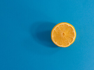 Half lemon and blue background