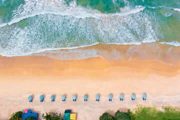 Aerial drone top view crowd of happy people relax at tropical Beach with sunset in Phuket, Thailand, Beautiful Phuket beach is famous tourist destination at Andaman sea. Holiday summer concept