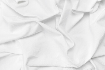 Eco textiles. White Fabric texture. White crumpled natural cotton fabric top view. Natural linen background. Fabric backdrop