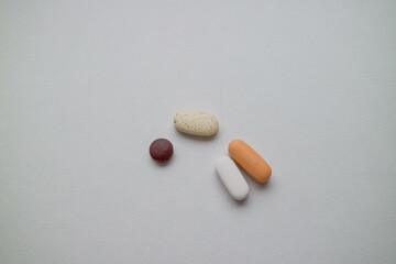 vitamins, pills and medicines are on the table. pills on a white background.