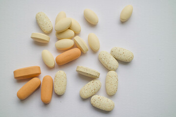 vitamins, pills and medicines are on the table. pills on a white background.