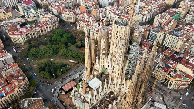 Aerial drone view of Barcelona, Spain. Blocks with multiple residential buildings and Sagrada Familia