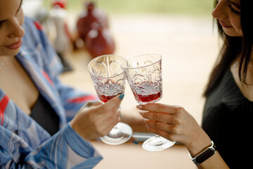 Lesbian couple on a date in a restaurant drinking wine