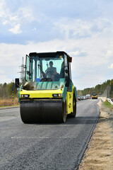 Fototapeta na wymiar laying of new asphalt on the highway. Road works